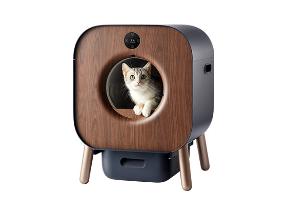 Exact PAWBBY P1 Ultra self-cleaning litter box with wood-look front, dark side housing, raised legs and an inserted cat in manufacturer artwork.